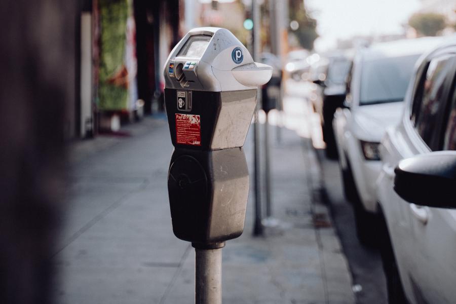Cars parked on a street at a parking meter
