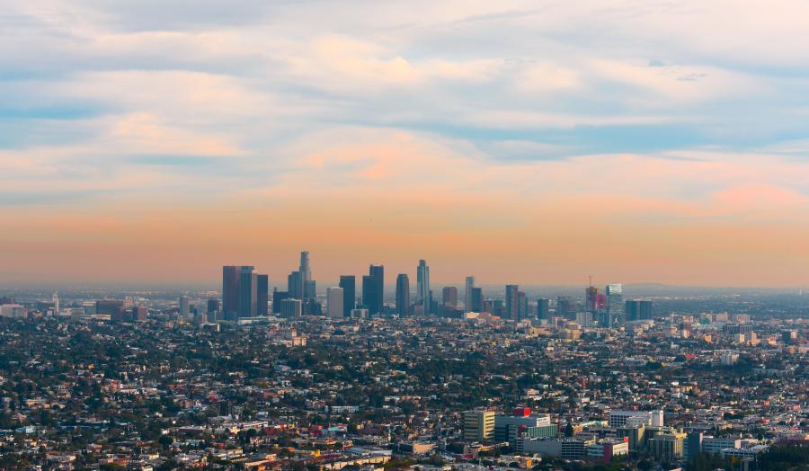 View of a city skyline with smog layer in the morning